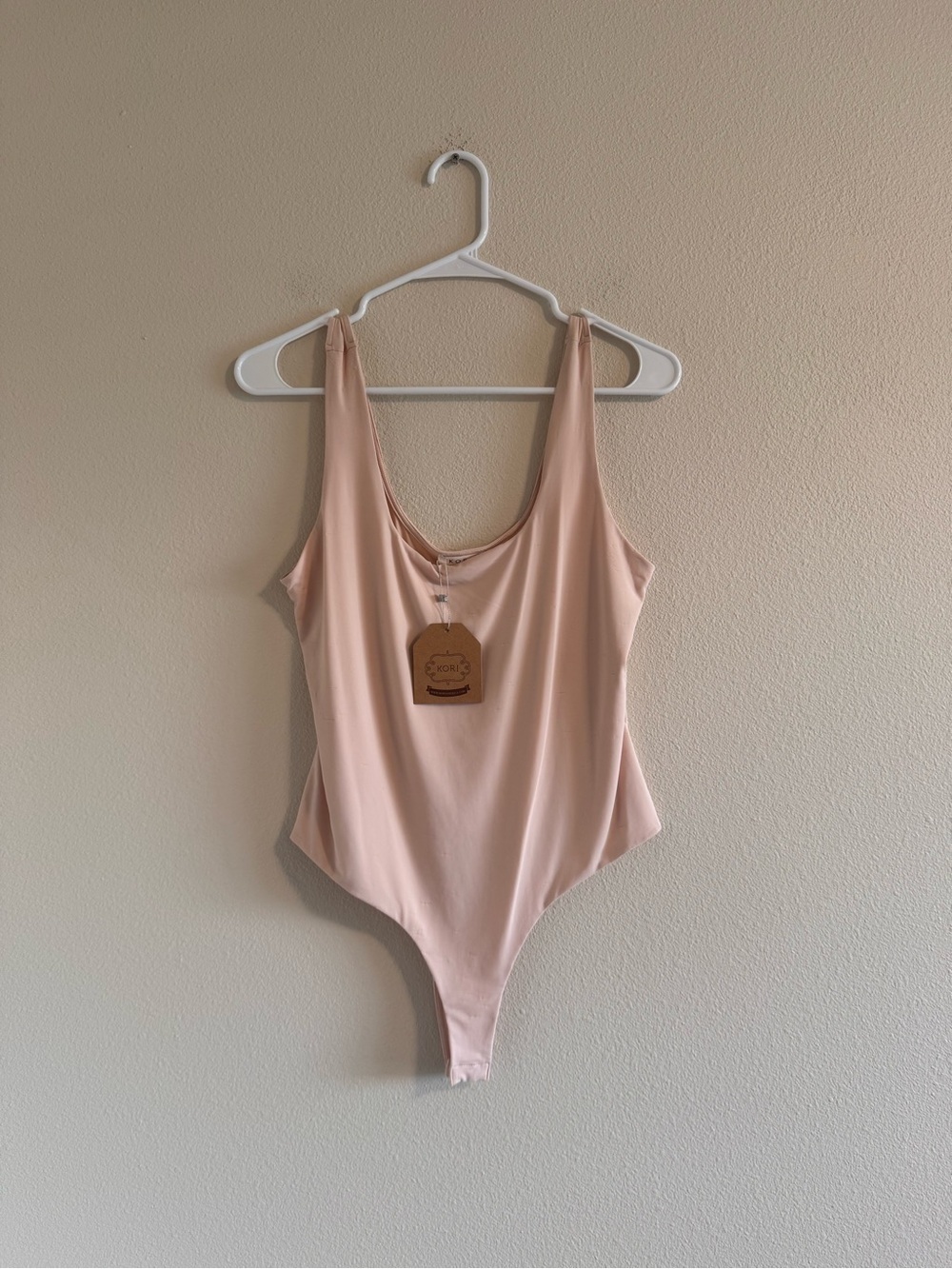 NWT Kori Pale Pink Stretch One-Piece Bodysuit